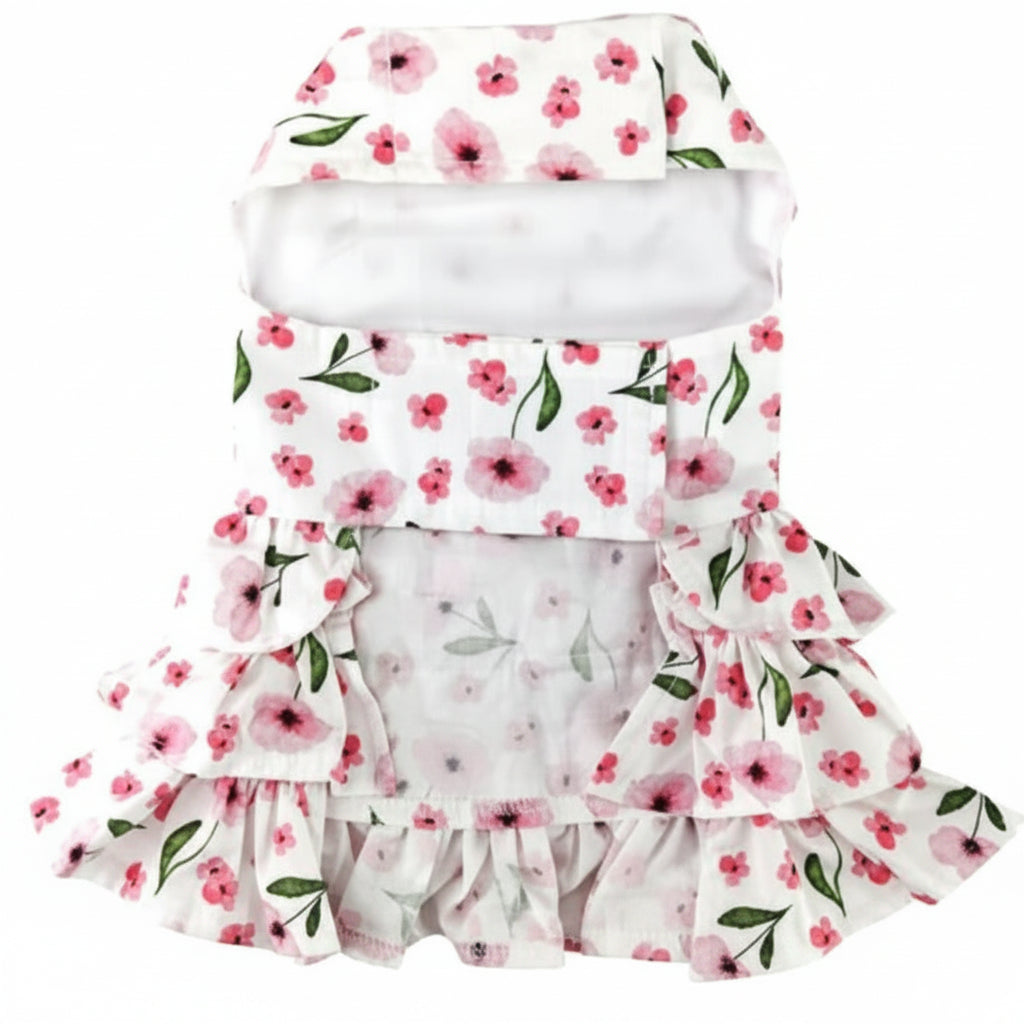 Floral pet dress with ruffles on a white background