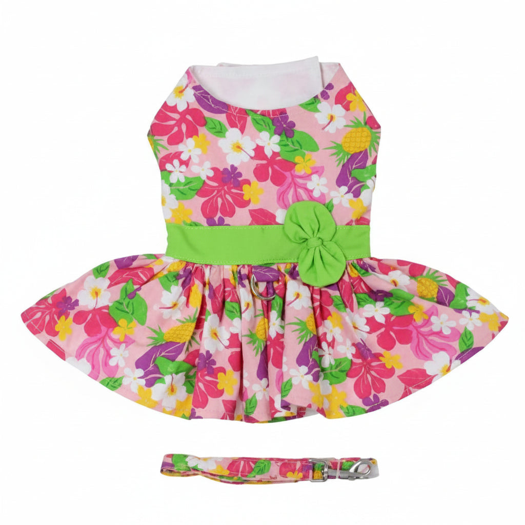Colorful floral dress with a green bow and matching headband on a white background