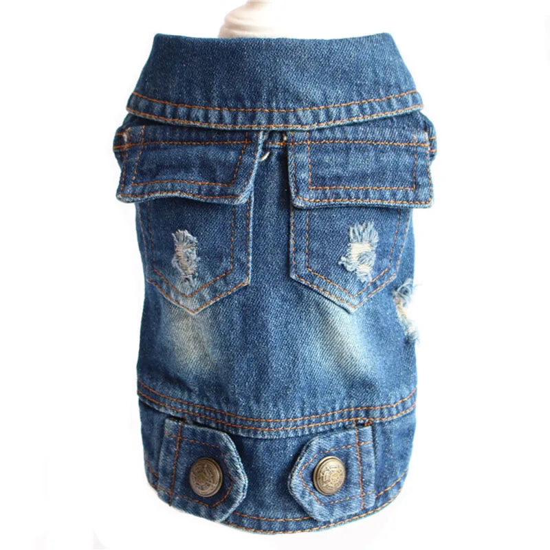 A blue denim pet vest with distressed details, faux pockets, and metal snap buttons, displayed on a mannequin torso against a white background.