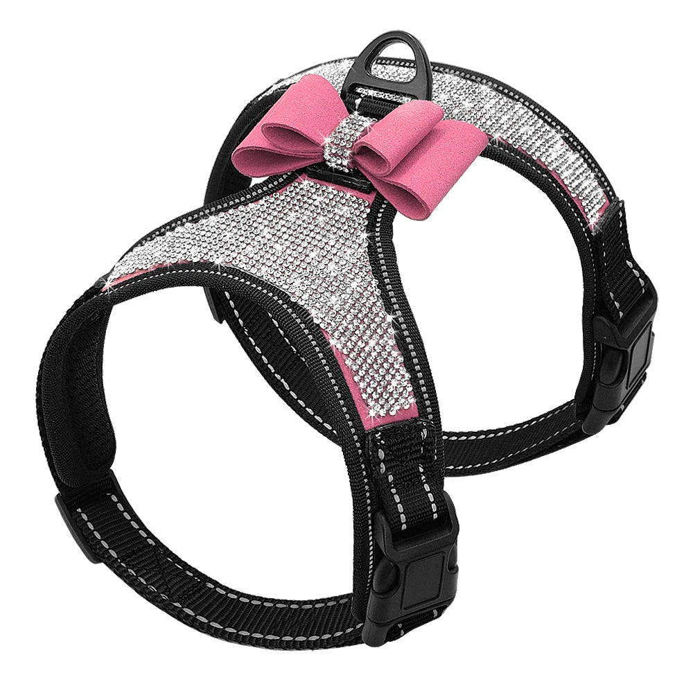 Dog harness with pink bow and rhinestone details on a white background