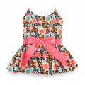 Floral dress with a large pink bow on a white background