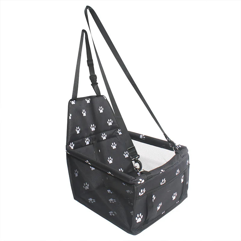 Black pet carrier with white paw prints on a white background