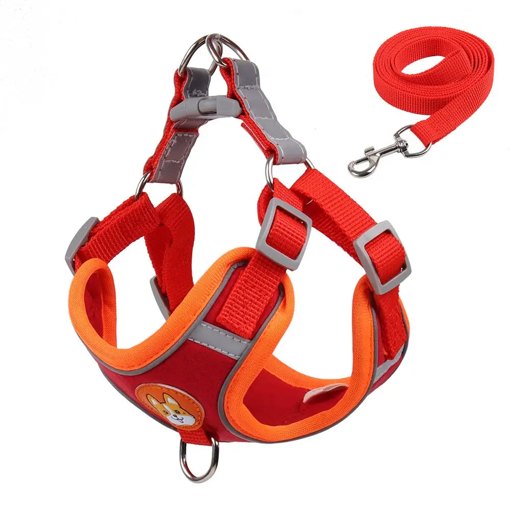 Red and orange dog harness with reflective stripes on a white background