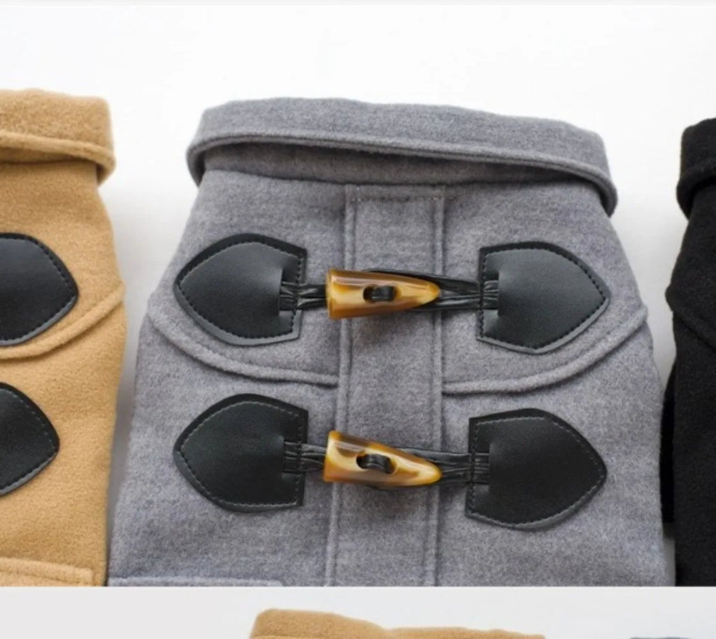 Gray pet coat with black and gold shovel-shaped decorations on a white background
