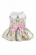 Floral dress with a pink bow for a dog on a white background